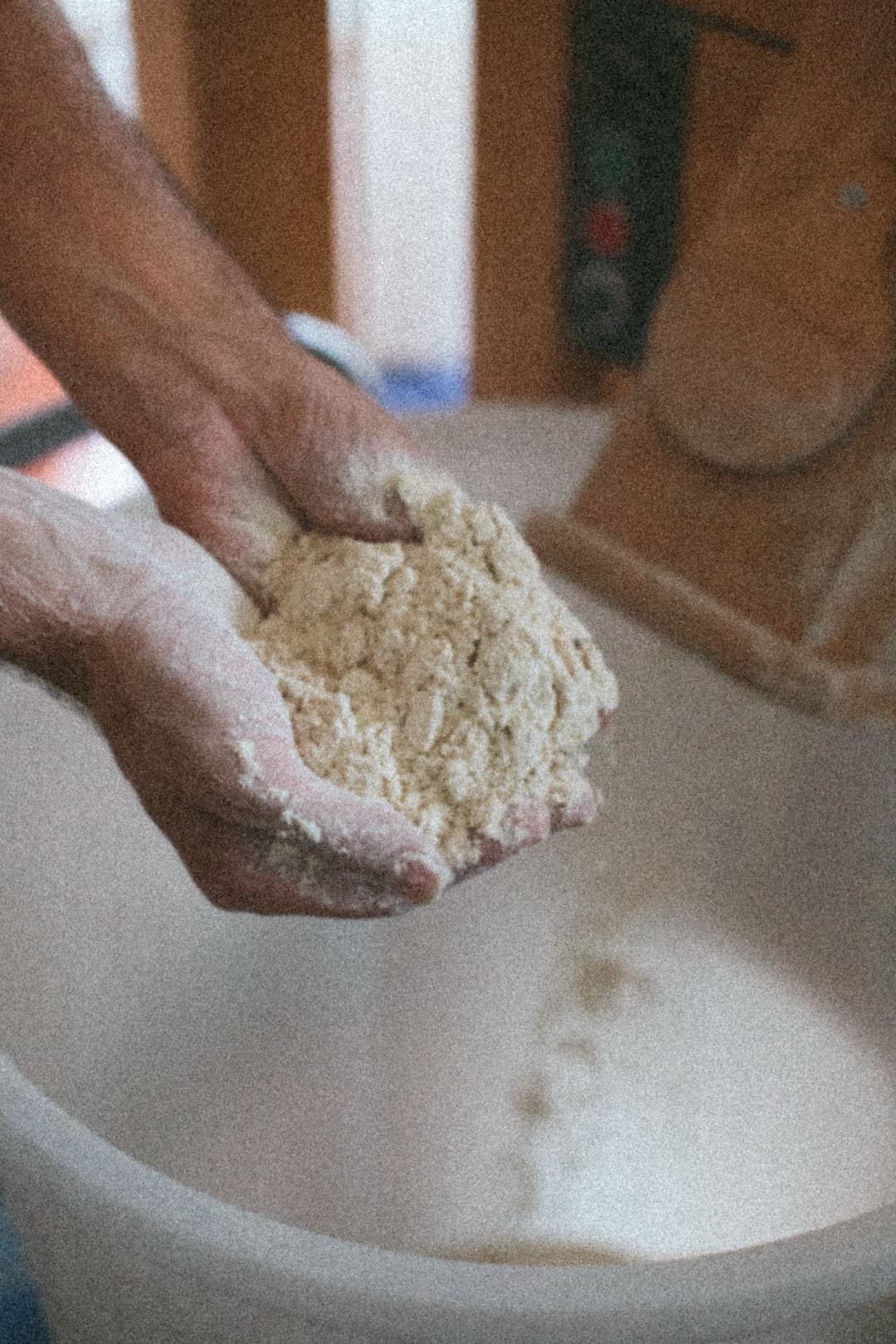Baker's hands working with flour