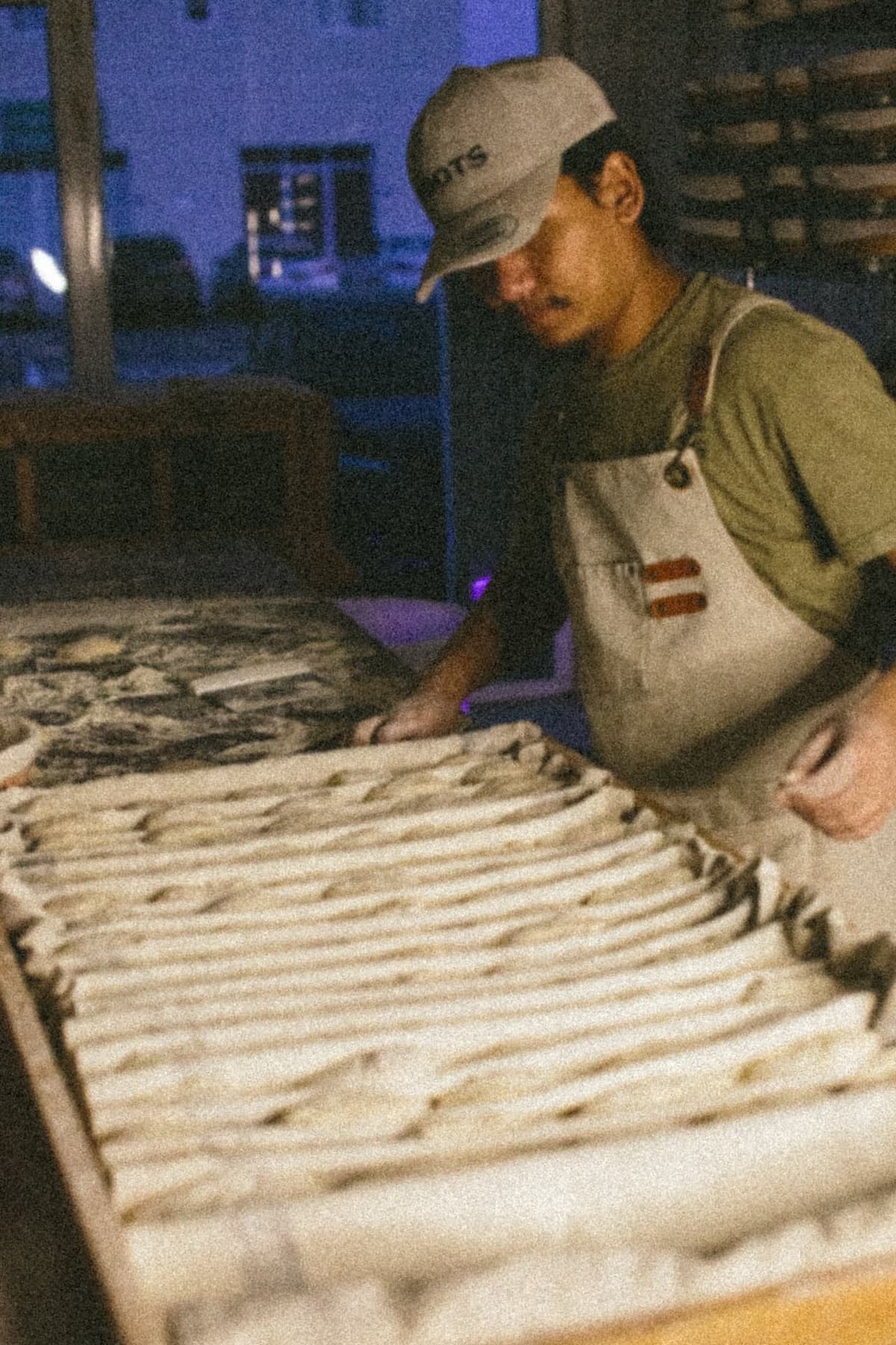 Baker at work in the Roots Bread bakery